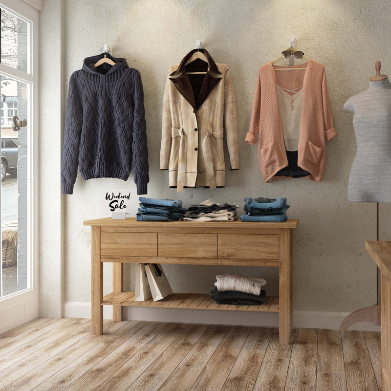 Patère minimaliste blanc mat pour suspendre les vêtements dans une boutique